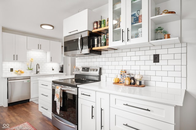 6640 E Washington St, Indianapolis, IN 46219 - kitchen featuring stainless steel appliances, open shelves, a sink, and light countertops