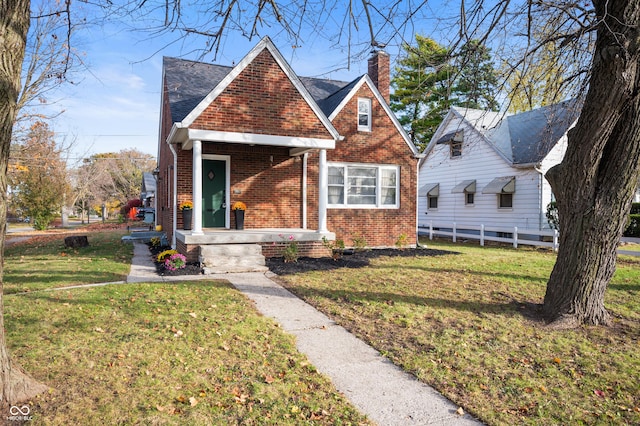 6640 E Washington St, Indianapolis, IN 46219 - view of front of property with brick siding and a chimney
