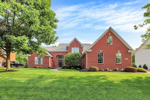 2614 Daylily Ct, Westfield, IN 46074 - traditional-style house featuring a front yard and brick siding