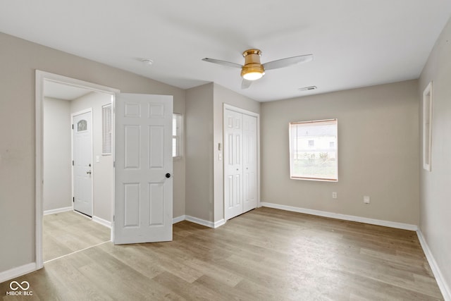 802 N Tuxedo St, Indianapolis, IN 46201 - unfurnished bedroom featuring light wood-style floors, baseboards, ceiling fan, and a closet