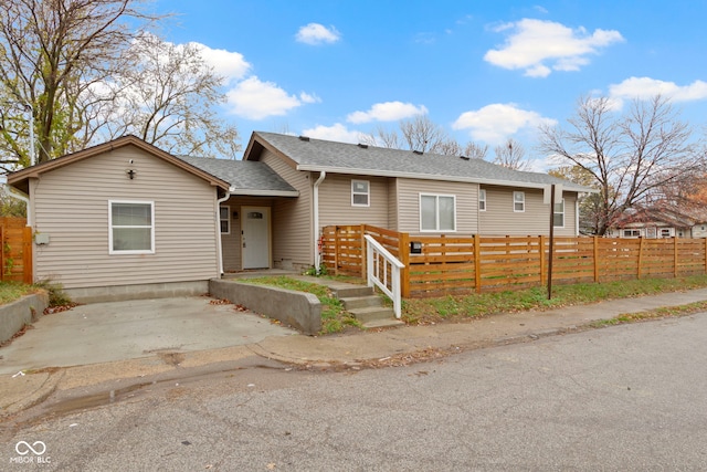 802 N Tuxedo St, Indianapolis, IN 46201 - view of front facade featuring roof with shingles and a patio area