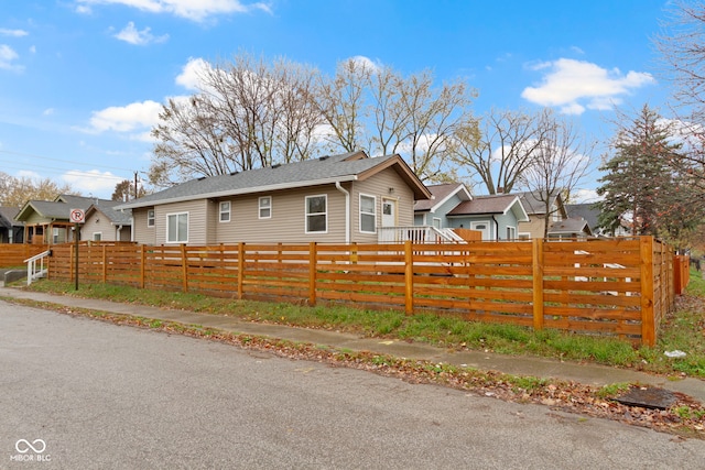 802 N Tuxedo St, Indianapolis, IN 46201 - view of side of home with a fenced front yard