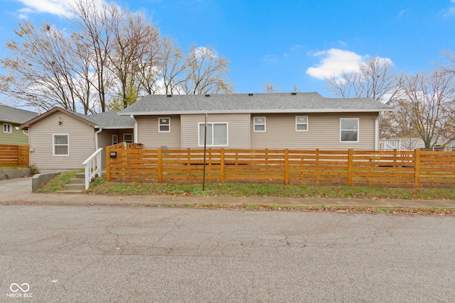 802 N Tuxedo St, Indianapolis, IN 46201 - rear view of house with a fenced front yard and roof with shingles
