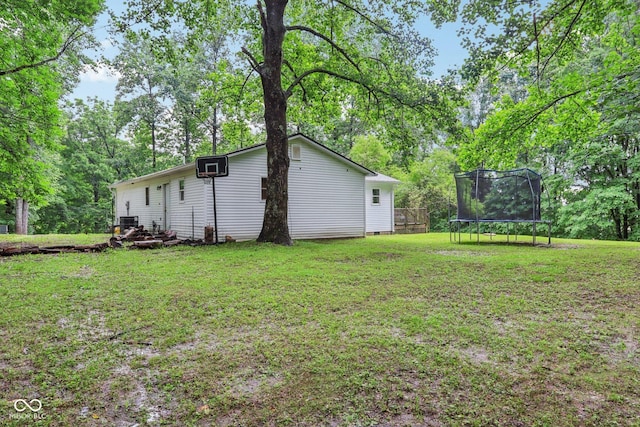 2640 S Silcox Rd, Paragon, IN 46166 - view of green lawn featuring a trampoline and view of scattered trees