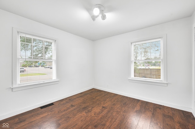 801 N Park St, Seymour, IN 47274 - empty room with baseboards and dark wood-style flooring