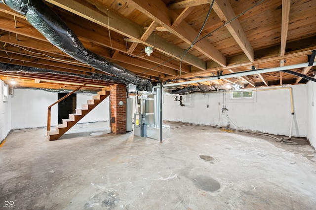 801 N Park St, Seymour, IN 47274 - basement with stairway, gas water heater, and heating unit