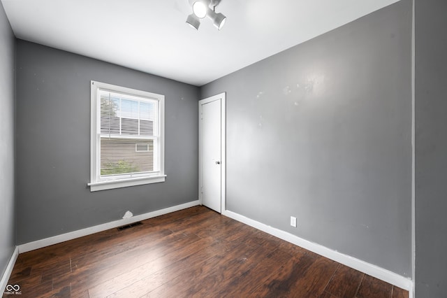 801 N Park St, Seymour, IN 47274 - unfurnished room featuring dark wood finished floors and baseboards