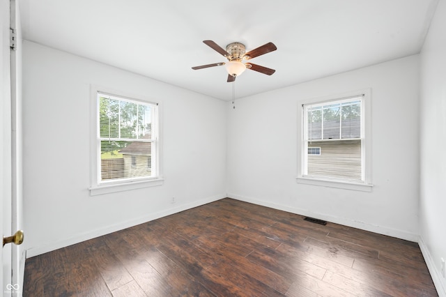 801 N Park St, Seymour, IN 47274 - unfurnished room with healthy amount of natural light, ceiling fan, and dark wood-type flooring