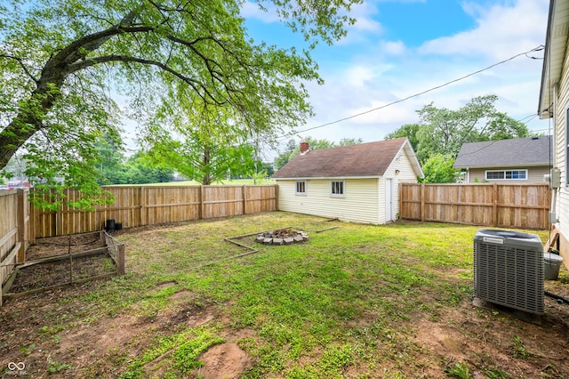 801 N Park St, Seymour, IN 47274 - view of yard featuring central AC unit and an outdoor fire pit
