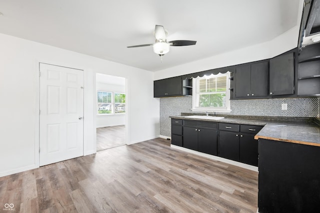 801 N Park St, Seymour, IN 47274 - kitchen with open shelves, a sink, tasteful backsplash, ceiling fan, and dark countertops