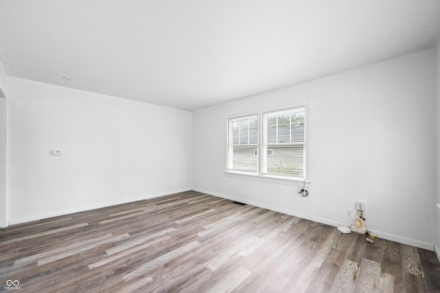 801 N Park St, Seymour, IN 47274 - empty room with wood finished floors and baseboards