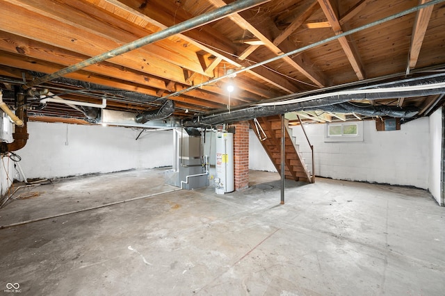 801 N Park St, Seymour, IN 47274 - below grade area featuring gas water heater and stairs