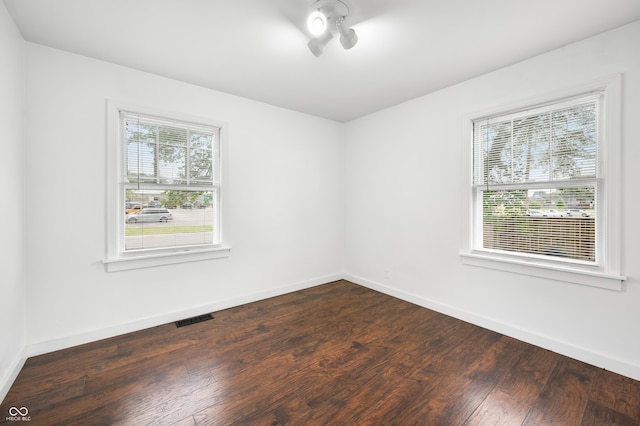 801 N Park St, Seymour, IN 47274 - empty room with dark wood-type flooring and baseboards