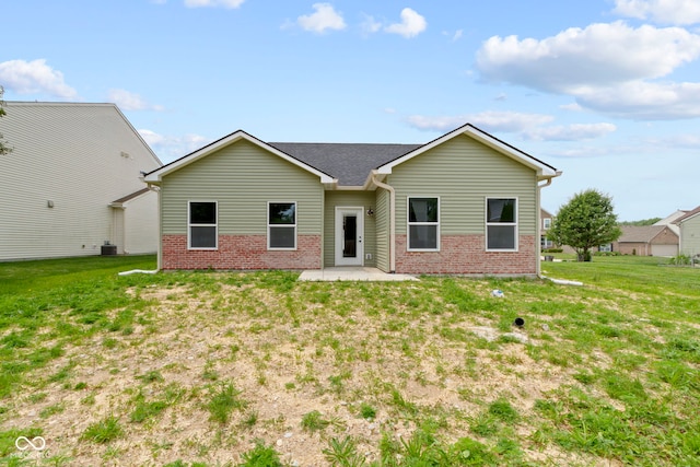 8355 Fieldfare Way, Indianapolis, IN 46237 - view of front of house with brick siding, a patio area, and a front yard