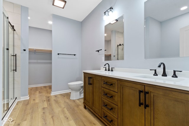 8355 Fieldfare Way, Indianapolis, IN 46237 - full bath featuring a shower stall, double vanity, toilet, wood finished floors, and baseboards