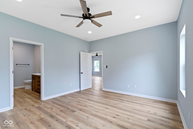 8355 Fieldfare Way, Indianapolis, IN 46237 - unfurnished bedroom featuring light wood-type flooring, baseboards, connected bathroom, and recessed lighting