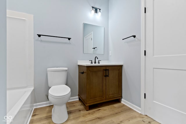8355 Fieldfare Way, Indianapolis, IN 46237 - full bath featuring wood finished floors, vanity, toilet, and baseboards