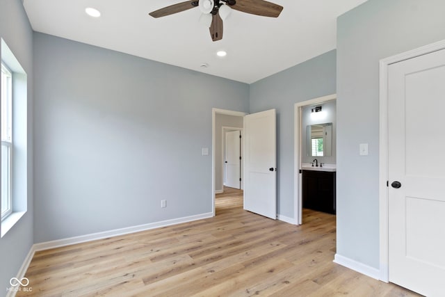 8355 Fieldfare Way, Indianapolis, IN 46237 - unfurnished bedroom featuring light wood-style floors, baseboards, recessed lighting, ceiling fan, and ensuite bath