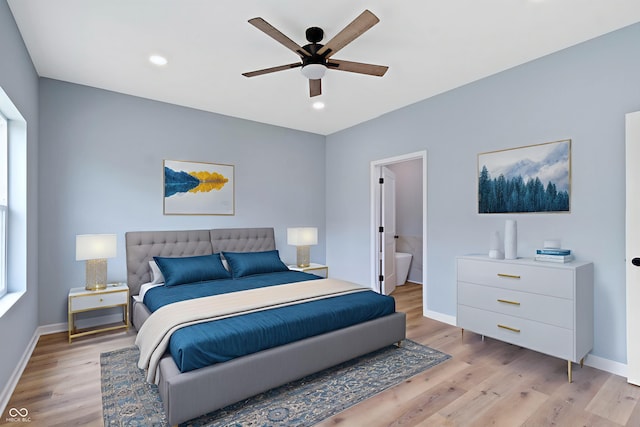 8355 Fieldfare Way, Indianapolis, IN 46237 - bedroom with light wood-style flooring, baseboards, recessed lighting, ceiling fan, and ensuite bath