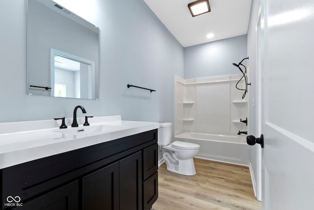 8355 Fieldfare Way, Indianapolis, IN 46237 - full bathroom featuring toilet, vanity, wood finished floors, and  shower combination