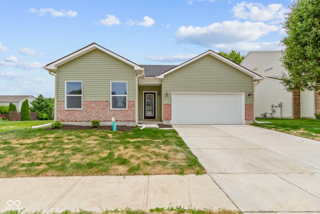 8355 Fieldfare Way, Indianapolis, IN 46237 - ranch-style house featuring an attached garage, brick siding, concrete driveway, and a front yard