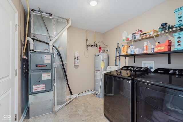 11521 Short Iron Ln, Indianapolis, IN 46235 - laundry area featuring electric water heater, separate washer and dryer, heating unit, and a textured ceiling