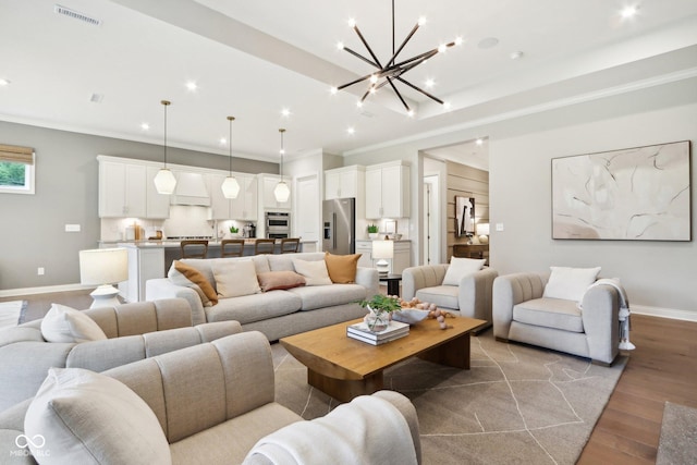 12594 Pasco St, Fishers, IN 46038 - living room featuring ornamental molding, wood finished floors, baseboards, a chandelier, and recessed lighting