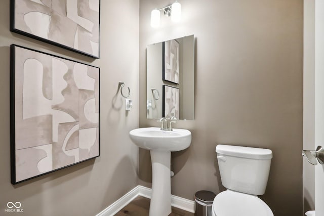 12594 Pasco St, Fishers, IN 46038 - half bathroom featuring baseboards and toilet