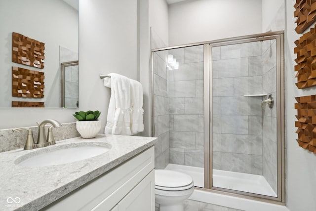 12594 Pasco St, Fishers, IN 46038 - bathroom featuring vanity, toilet, and a stall shower