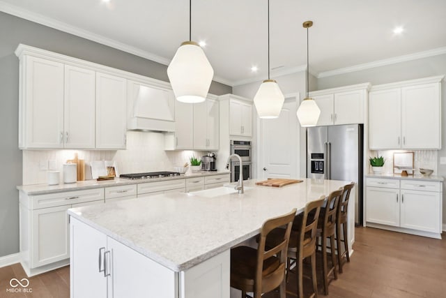 12594 Pasco St, Fishers, IN 46038 - kitchen with a sink, stainless steel appliances, premium range hood, tasteful backsplash, and white cabinets