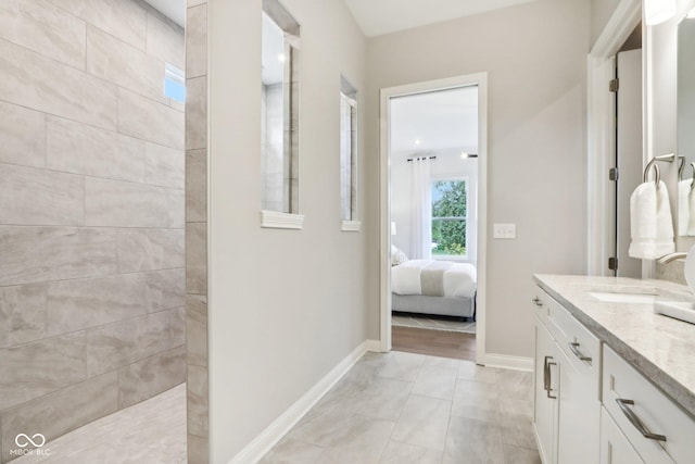 12594 Pasco St, Fishers, IN 46038 - ensuite bathroom featuring walk in shower, vanity, and baseboards