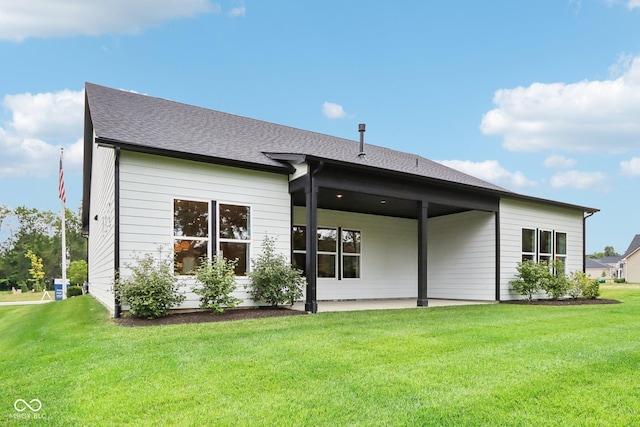 12594 Pasco St, Fishers, IN 46038 - rear view of house featuring a patio, a yard, and roof with shingles