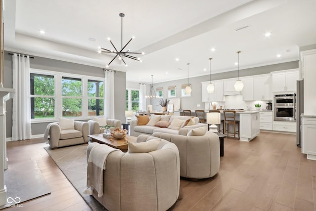 12594 Pasco St, Fishers, IN 46038 - living area featuring a chandelier, light wood-style floors, recessed lighting, ornamental molding, and baseboards