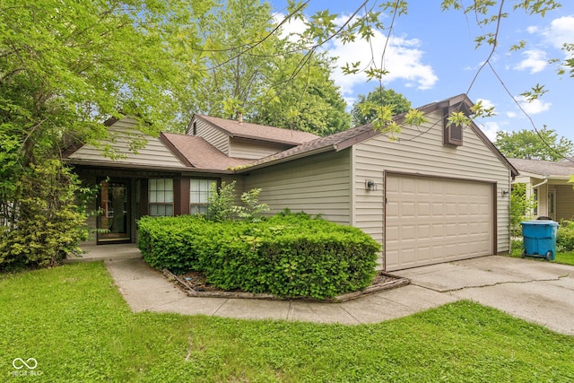 11114 Wismar Dr, Indianapolis, IN 46235 - view of front of home featuring an attached garage, asphalt driveway, a front lawn, and a shingled roof