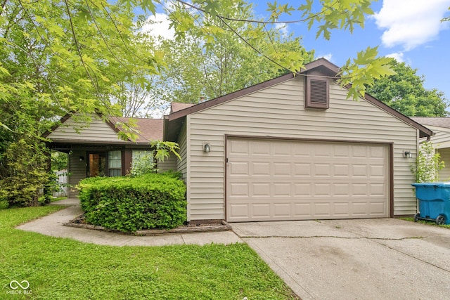 11114 Wismar Dr, Indianapolis, IN 46235 - view of front of home with driveway, an attached garage, and roof with shingles