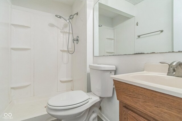 11114 Wismar Dr, Indianapolis, IN 46235 - bathroom with toilet, a shower, and vanity