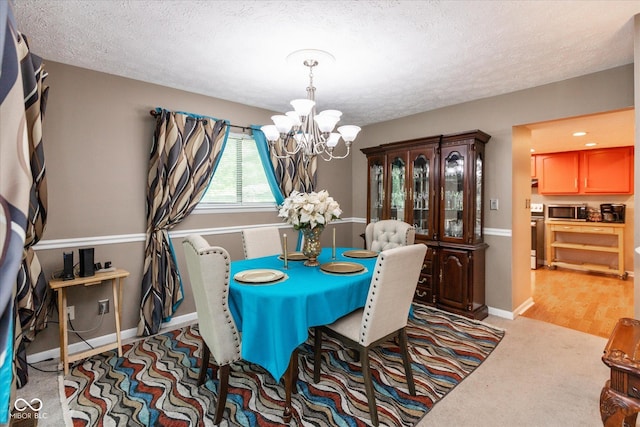 4965 Hawthorne Way, Avon, IN 46123 - dining space with a chandelier, a textured ceiling, and light carpet