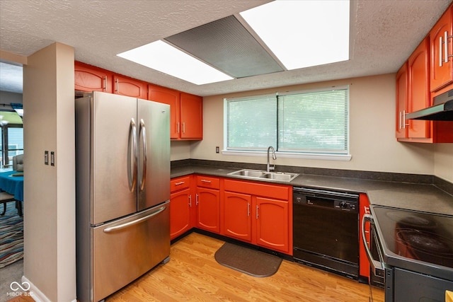 4965 Hawthorne Way, Avon, IN 46123 - kitchen featuring black appliances, dark countertops, light wood finished floors, a textured ceiling, and under cabinet range hood