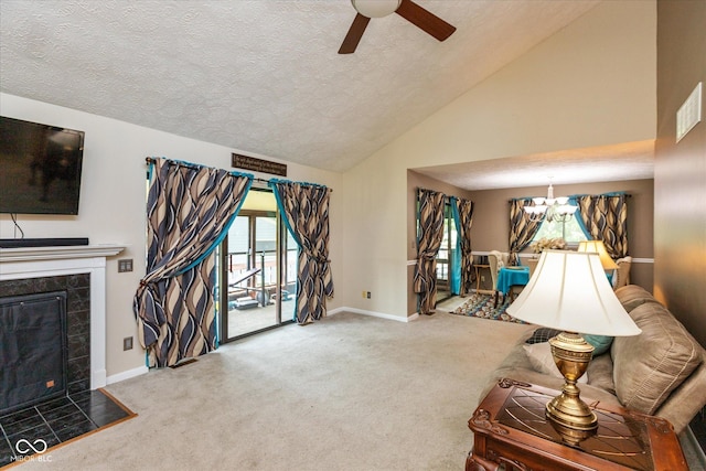 4965 Hawthorne Way, Avon, IN 46123 - carpeted living room with a ceiling fan, a textured ceiling, a tile fireplace, a chandelier, and high vaulted ceiling