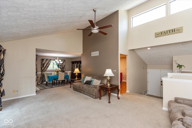 4965 Hawthorne Way, Avon, IN 46123 - carpeted living room featuring ceiling fan, high vaulted ceiling, plenty of natural light, a textured ceiling, and a chandelier