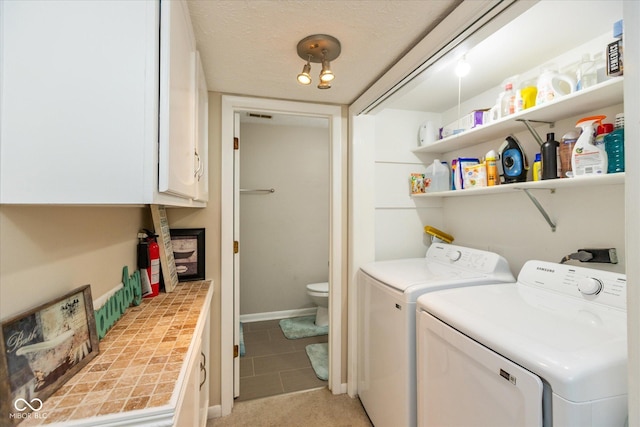 4965 Hawthorne Way, Avon, IN 46123 - laundry room featuring washer and dryer, cabinet space, and light tile patterned floors