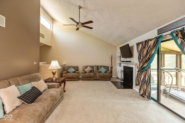 4965 Hawthorne Way, Avon, IN 46123 - living room with a ceiling fan, carpet floors, a textured ceiling, lofted ceiling, and a fireplace with flush hearth