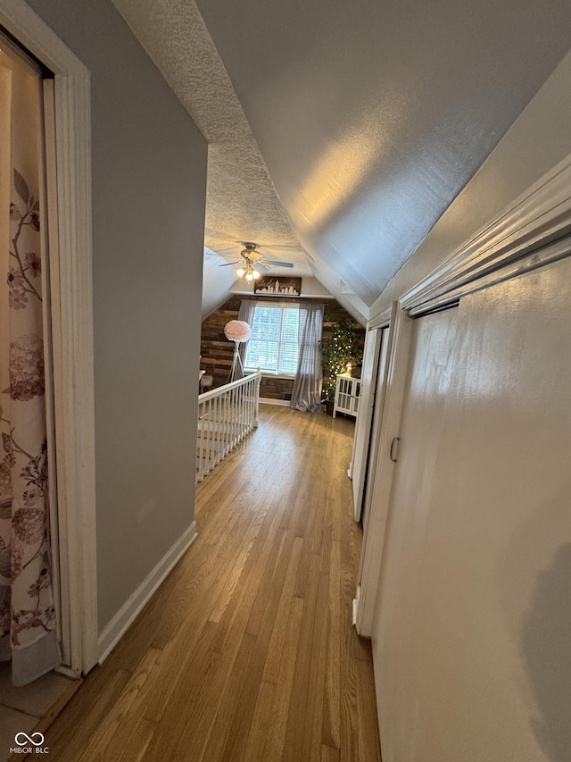 537 N 17th St, Noblesville, IN 46060 - corridor featuring hardwood / wood-style floors, lofted ceiling, and a textured ceiling