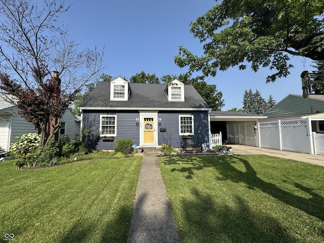 537 N 17th St, Noblesville, IN 46060 - cape cod-style house featuring a carport, concrete driveway, and roof with shingles