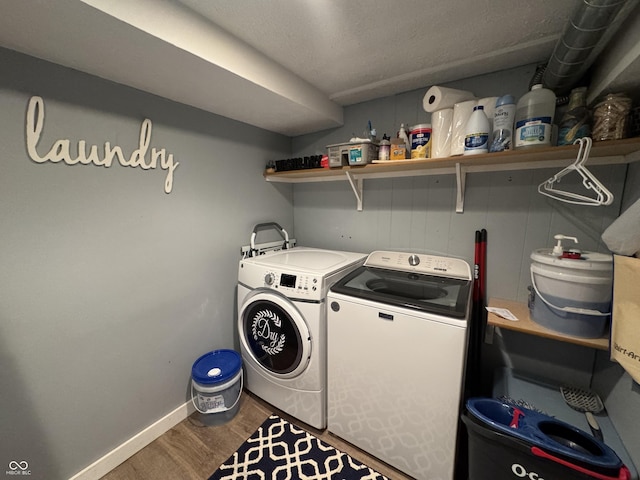 537 N 17th St, Noblesville, IN 46060 - laundry room featuring wood finished floors and washer and clothes dryer