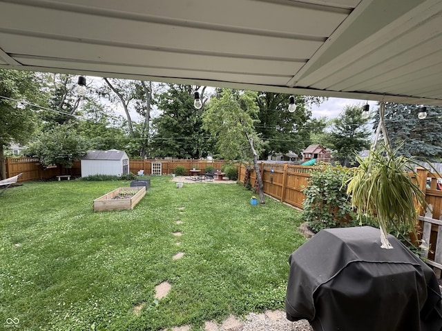 537 N 17th St, Noblesville, IN 46060 - fenced backyard with a storage unit and a vegetable garden