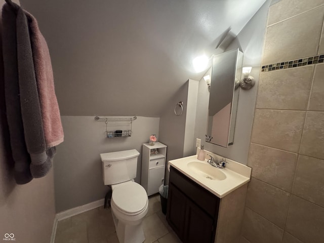 537 N 17th St, Noblesville, IN 46060 - bathroom featuring vanity, lofted ceiling, and tile patterned flooring
