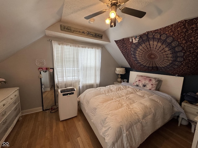 537 N 17th St, Noblesville, IN 46060 - bedroom with wood finished floors, vaulted ceiling, and a ceiling fan
