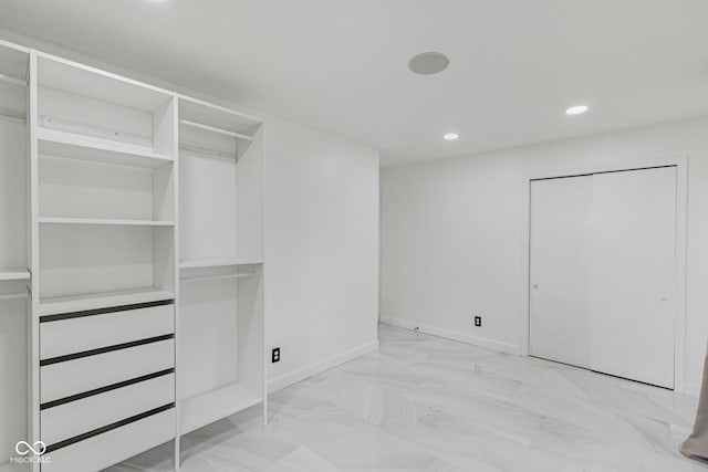 3141 Citadel Ct, Indianapolis, IN 46268 - unfurnished bedroom featuring recessed lighting, marble finish floors, and a closet