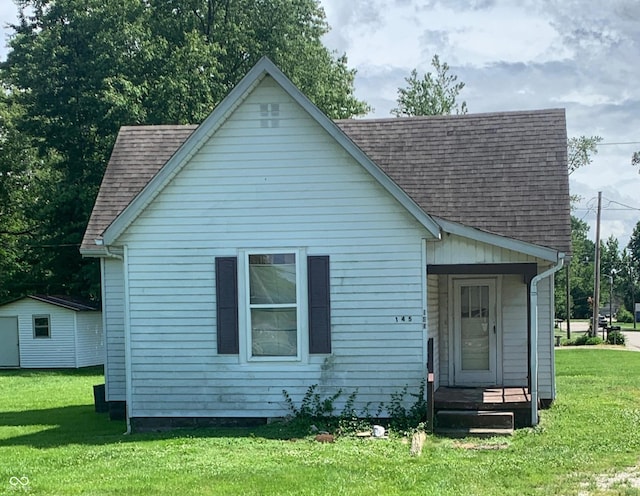 145 Hayden Pike, North Vernon, IN 47265 - bungalow-style house featuring a shingled roof, a front yard, and a porch